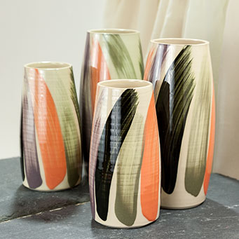 Collection of stoneware vases with brushed slip decoration