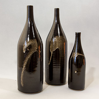 Three stoneware bottles with brush decoration